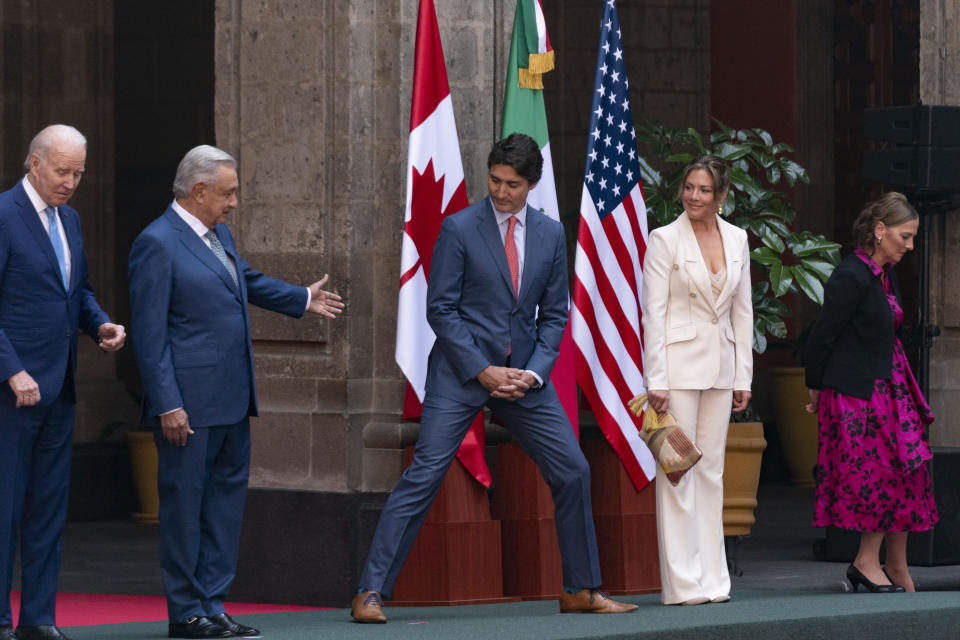 Obrador's wife Beatriz Gutiérrez Müller, right, and Trudeau's wife Sophie Grégoire Trudeau, second from right, move off stage for a group photo with President Joe Biden, Mexican President Andres Manuel Lopez Obrador, and Canadian Prime Minister Justin Trudeau, at an arrival ceremony at the 10th North American Leaders' Summit at the National Palace in Mexico City, Tuesday, Jan. 10, 2023. (AP Photo/Andrew Harnik)