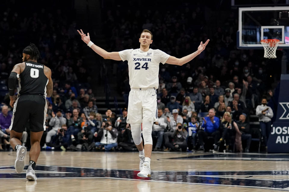 Xavier forward Jack Nunge (24) reacts after making a three point basket during the first half of an NCAA college basketball game against Providence, Wednesday, Jan. 26, 2022, in Cincinnati. (AP Photo/Jeff Dean)