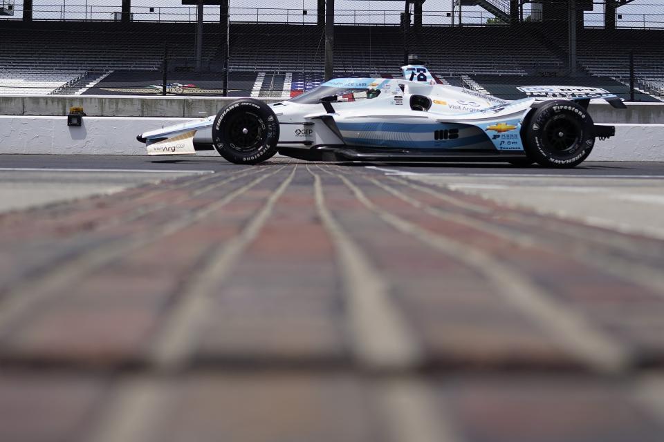 Agustin Canapino, of Argentina, drives down pit lane during practice for the Indianapolis 500 auto race at Indianapolis Motor Speedway, Monday, May 22, 2023, in Indianapolis. (AP Photo/Darron Cummings)