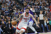 Houston Rockets guard Austin Rivers (25) drives around Utah Jazz forward Royce O'Neale, rear, in the first half during an NBA basketball game Monday, Jan. 27, 2020, in Salt lake City. (AP Photo/Rick Bowmer)