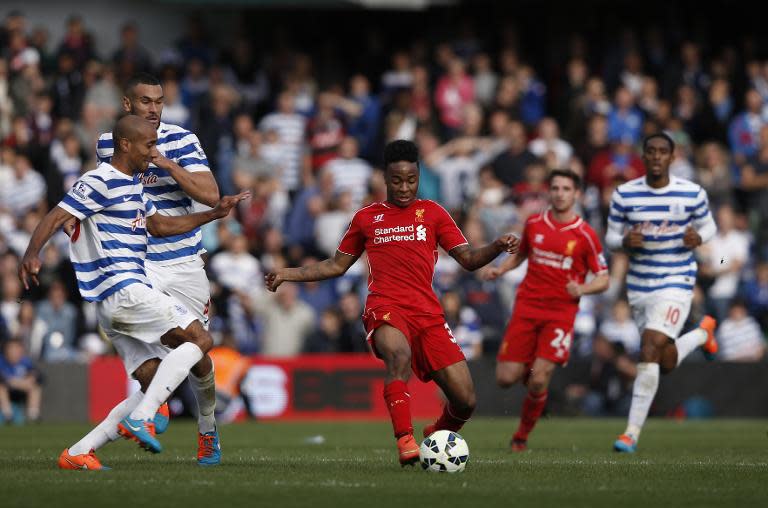 Liverpool's Raheem Sterling (C) cuts through the defence during an English Premier League match against Queens Park Rangers at Loftus Road in London on October 19, 2014