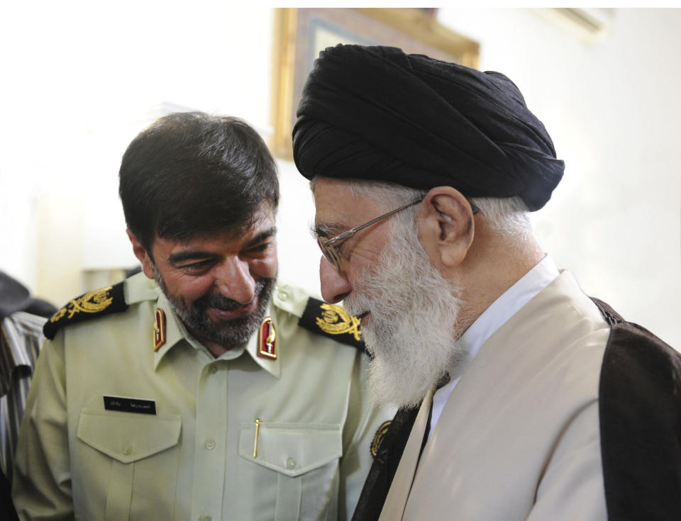 In this undated photo released on Saturday, Jan. 7, 2023, by the official website of the office of the Iranian supreme leader, Supreme Leader Ayatollah Ali Khamenei, right, speaks with Gen. Ahmad Reza Radan, Iran. Ayatollah Khamenei on Saturday, Jan. 7, appointed Gen. Radan as the new chief of police. Radan, who served as acting commander of police from 2008-2014, is known for his harsh handling of protesters during post-election turmoil in 2009. (Office of the Iranian Supreme Leader via AP)