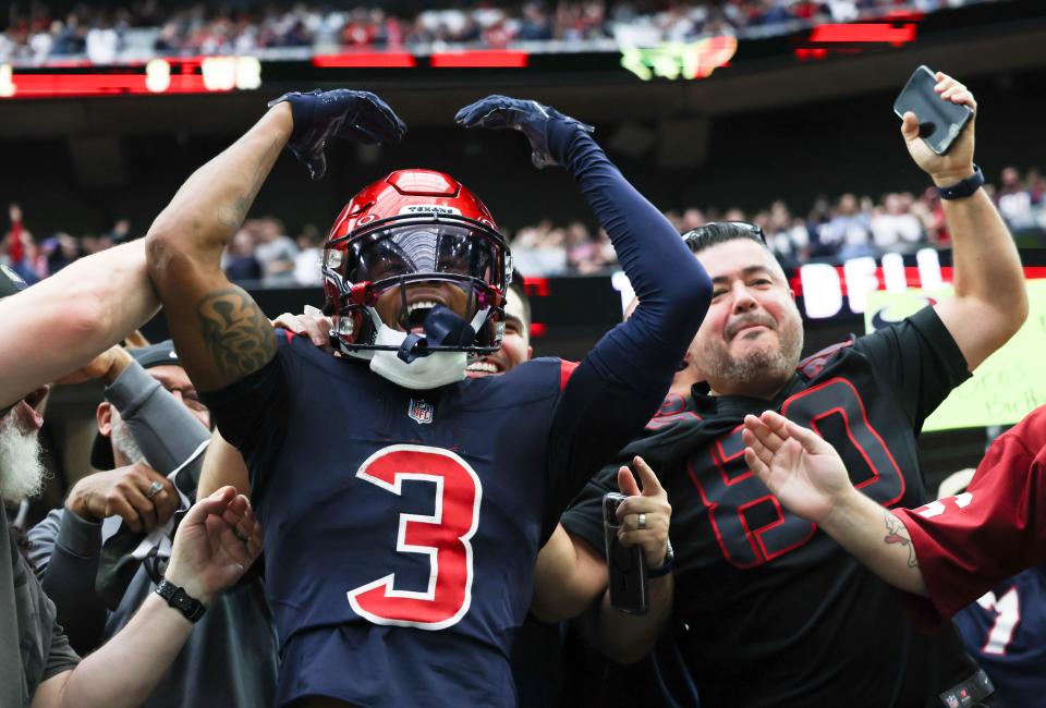 Texans wide receiver Tank Dell celebrates a touchdown catch last season against the Arizona Cardinals.
