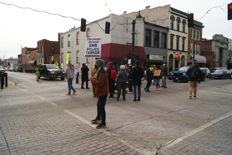 A group of protesters marching on Belleville streets Saturday stopped in the intersection of East Main and North High streets after one of the protesters shouted “occupy.” Shortly after this photo was taken, a pickup truck driver going west on East Main Street was blocked by protesters but then the truck kept on driving slowly to turn right onto North High Street. One of the protesters was injured after falling off the back of the truck. The group was protesting police violence in the wake of Tyre Nichols’ death in Memphis.