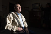 Pearl Harbor survivor and World War II Navy veteran David Russell, 101, poses for a photo at his home on Monday, Nov. 22, 2021, in Albany, Ore. (AP Photo/Nathan Howard)