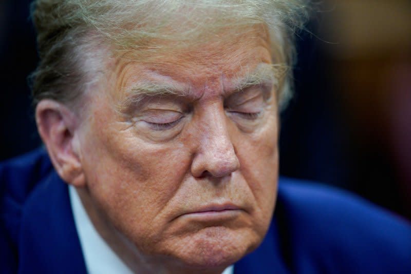 Former President Donald Trump waits for his criminal trial to begin at Manhattan Criminal Court in New York on Tuesday. Trump has a Thursday hearing set for new comments he made. Pool Photo by Eduardo Munoz/UPI