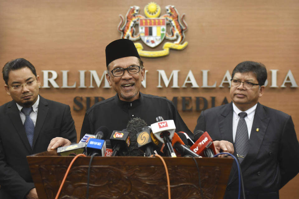 Malaysia's politician Anwar Ibrahim speaks to the media during a press conference following the swearing-in ceremony at the parliament in Kuala Lumpur, Malaysia, Monday, Oct. 15, 2018. Malaysian Prime Minister-in-waiting Anwar Ibrahim has taken his oath as a lawmaker, marking his return to active politics three years after he was imprisoned for sodomy in a charge critics said was politically motivated. (AP Photo/Yam G-Jun)