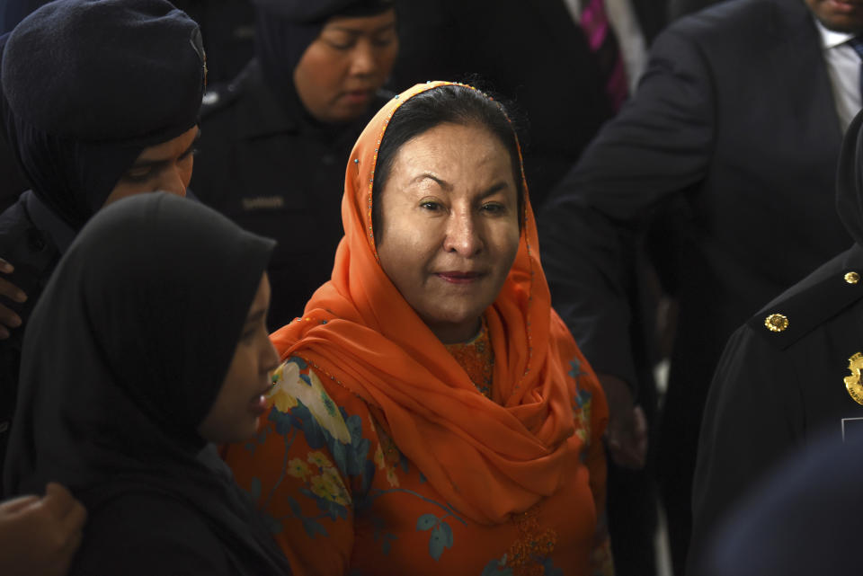 FILE - Rosmah Mansor, wife of former Malaysian Prime Minister Najib Razak arrives at Kuala Lumpur High Court in Kuala Lumpur, Malaysia, on Oct. 4, 2018. The wife of jailed ex-Prime Minister Najib Razak arrived in court Thursday, Sept. 1, 2022, for a verdict in her corruption trial involving a 1.25 billion ringgit ($279 million) solar energy project, just days after her husband was imprisoned over the looted 1MDB state fund.(AP Photo/Yam G-Jun, File)