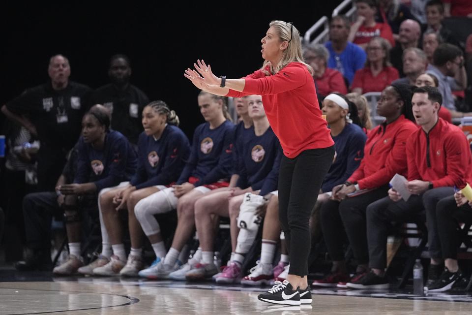 Indiana Fever coach Christie Sides gestures to players during the first half of the team's WNBA basketball game against the Connecticut Sun, Friday, May 19, 2023, in Indianapolis. (AP Photo/Darron Cummings)