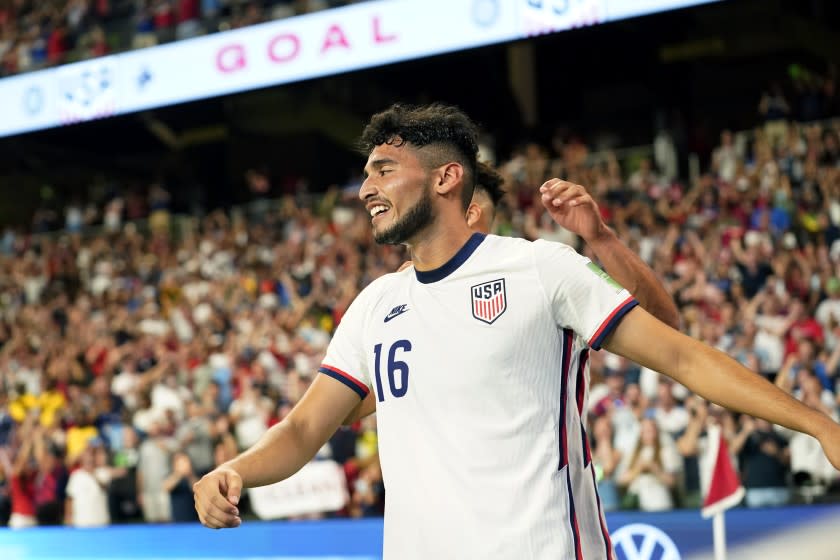 United States' Ricardo Pepi (16) celebrates with teammates after scoring his second goal against Jamaica.