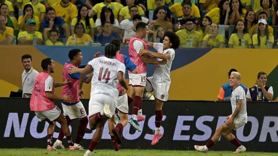 Venezuela's players celebrate Bello's goal. - Pedro Vilela/Getty Images