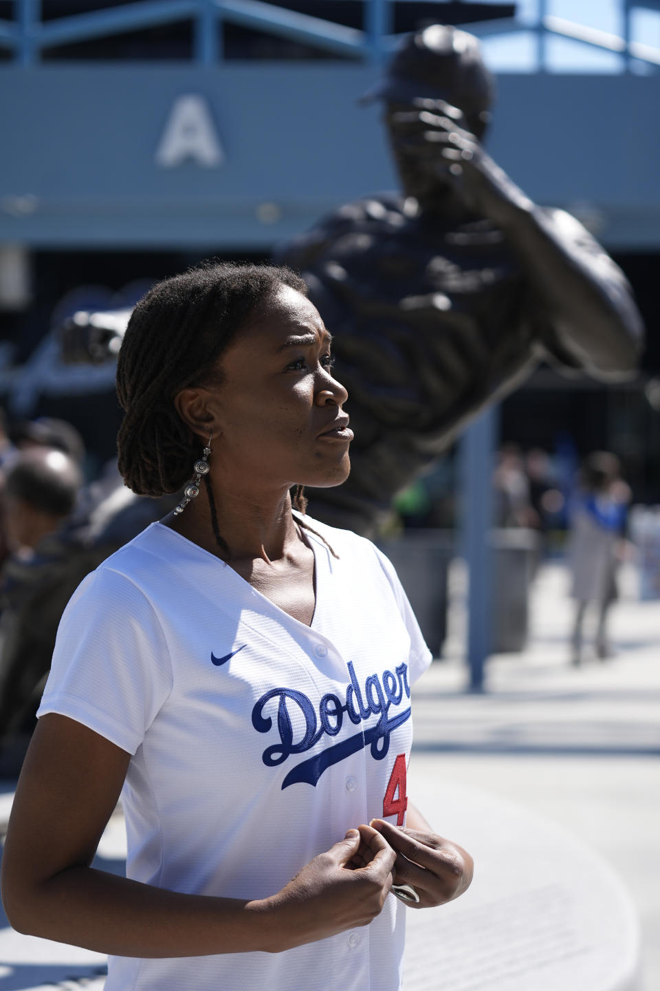 Ayo Robinson, the granddaughter of baseball great Jackie Robinson, attends a celebration for Jackie Robinson Day at Dodgers Stadium before a game between the Dodgers and the Washington Nationals in Los Angeles, Monday, April 15, 2024. (AP Photo/Damian Dovarganes)