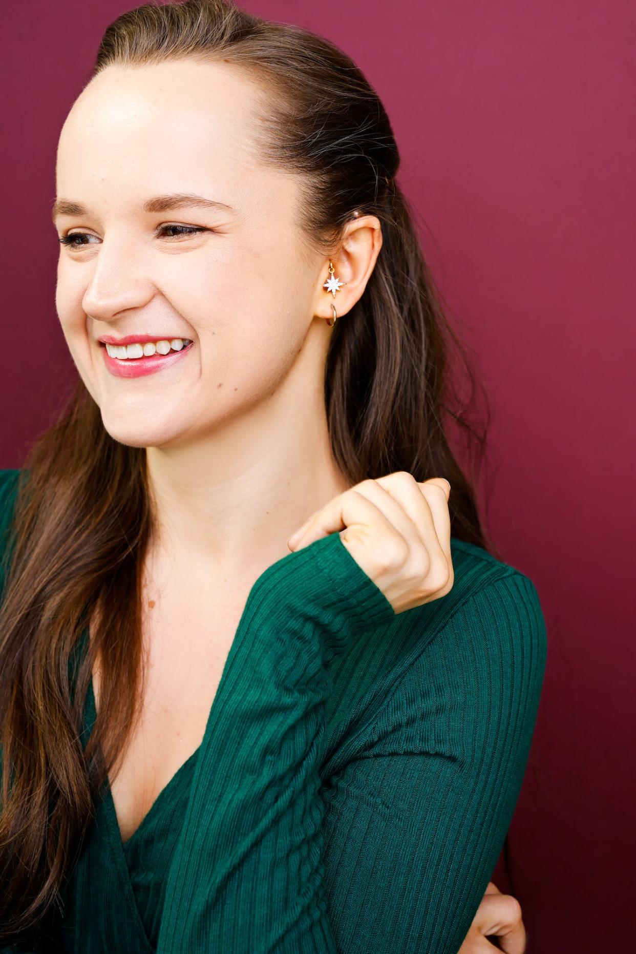 Kathy Dorn wearing a charm on her hearing aids.