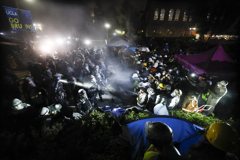 Police deployed a heavy presence on US university campuses on May 1 after forcibly clearing away some weeks-long protests against Israel's war with Hamas. Dozens of police cars patrolled at the University of California, Los Angeles campus in response to violent clashes overnight when counter-protesters attacked an encampment of pro-Palestinian students.  (Etienne Laurent / AFP via Getty Images)