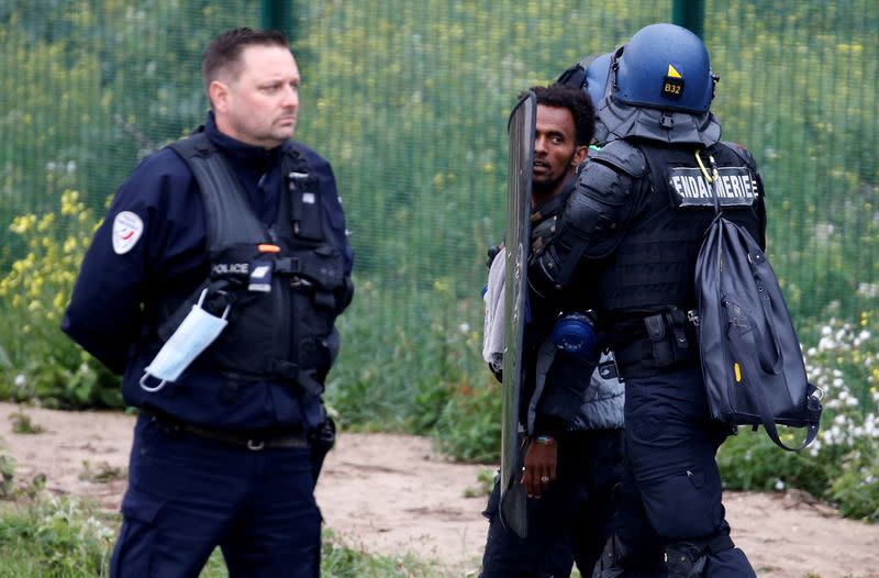 Dismantling of a makeshift shelter camp in Calais