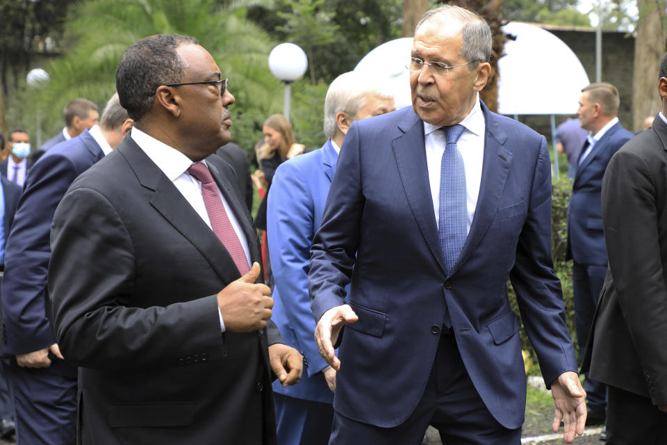FILE - Russian Foreign Minister Sergey Lavrov, right, speaks with Ethiopian Deputy Prime Minister Demeke Mekonnen, left, as they visit the compound of the Russian Embassy in Addis Ababa, Ethiopia, July 27, 2022. The Biden administration likes to say that Russia is now isolated internationally because of its invasion of Ukraine. Yet its top officials are hardly sitting lonely and isolated in the Kremlin and now the U.S. wants to talk.(AP Photo)