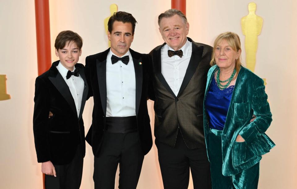 Farrell pictured with his son Henry as well as co-star Brendan Gleeson and his wife Mary (AFP via Getty Images)