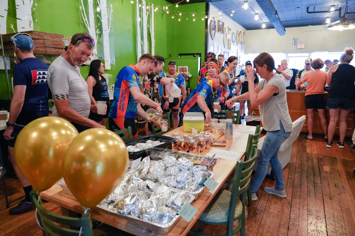 Riders stop at Sisters in Cheese in Madrid during the RAGBRAI route inspection ride, Wednesday, June 7, 2023. 