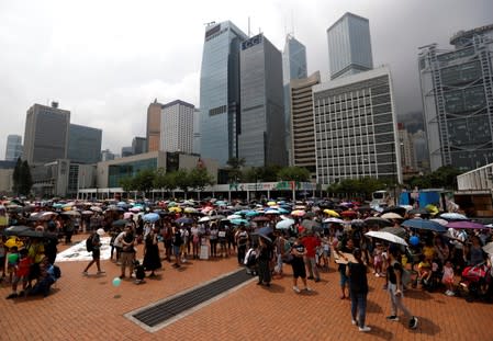 Family members participate in a protest rally titled "Guard Our Children's Future" at Edinburgh Place in Hong Kong, China