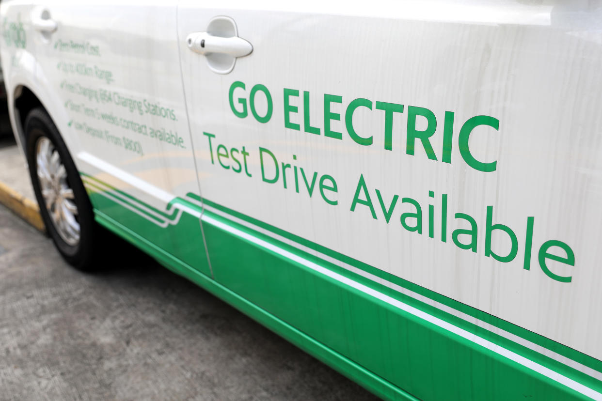 A Go Electric sign is displayed on a Grab vehicle in Singapore. (Getty Images file photo)