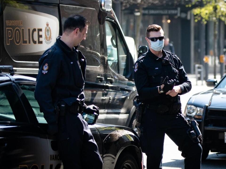 Vancouver Police officers pictured on Granville Street in Vancouver on Monday, April 20, 2020. The VPD will not be implementing a COVID-19 mandate for its civilian staff members and officers. (Maggie MacPherson/CBC - image credit)