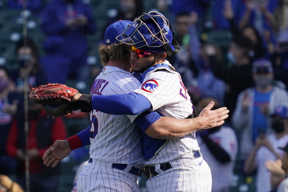 Chicago Cubs relief pitcher Craig Kimbrel, left, celebrates with catcher Willson Contreras after the Cubs defeated the Pittsburgh Pirates 4-3 in a baseball game in Chicago, Sunday, April 4, 2021. (AP Photo/Nam Y. Huh)