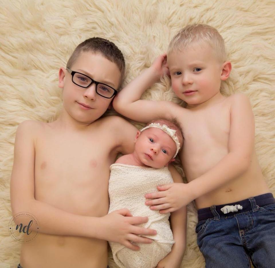 Samantha and Steven's sons with baby sister Abigail