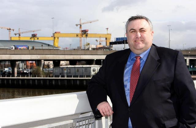 Former senior police officer Alan McQuillan leans against a railing