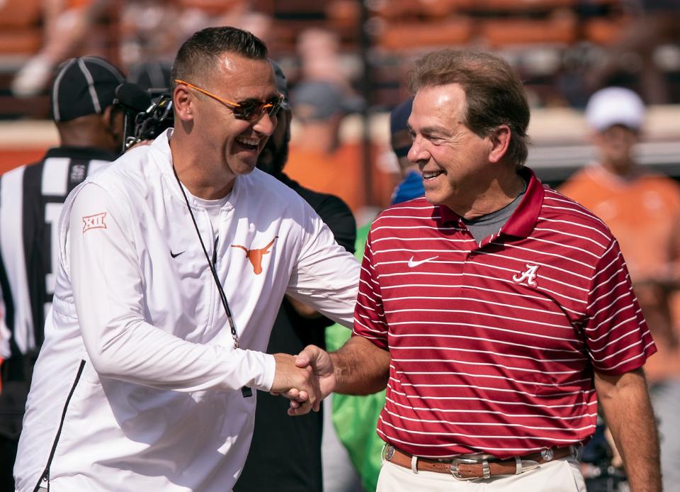 Texas head coach Steve Sarkisian, left, and Alabama head coach Nick Saban, right, meet on the field during team warmups before an NCAA college football game, Saturday, Sept. 10, 2022, in Austin, Texas. (AP Photo/Rodolfo Gonzalez)