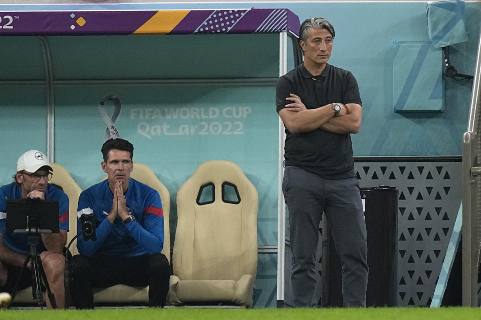 Switzerland's head coach Murat Yakin watches from the bench during the World Cup round of 16 soccer match between Portugal and Switzerland, at the Lusail Stadium in Lusail, Qatar, Tuesday, Dec. 6, 2022. (AP Photo/Pavel Golovkin)