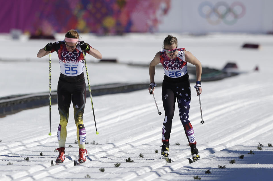 Germany's Nicole Fessel, left, and United States' Sadie Bjornsen ski on the finish straight during the women's 10K classical-style cross-country race at the 2014 Winter Olympics, Thursday, Feb. 13, 2014, in Krasnaya Polyana, Russia. (AP Photo/Matthias Schrader)