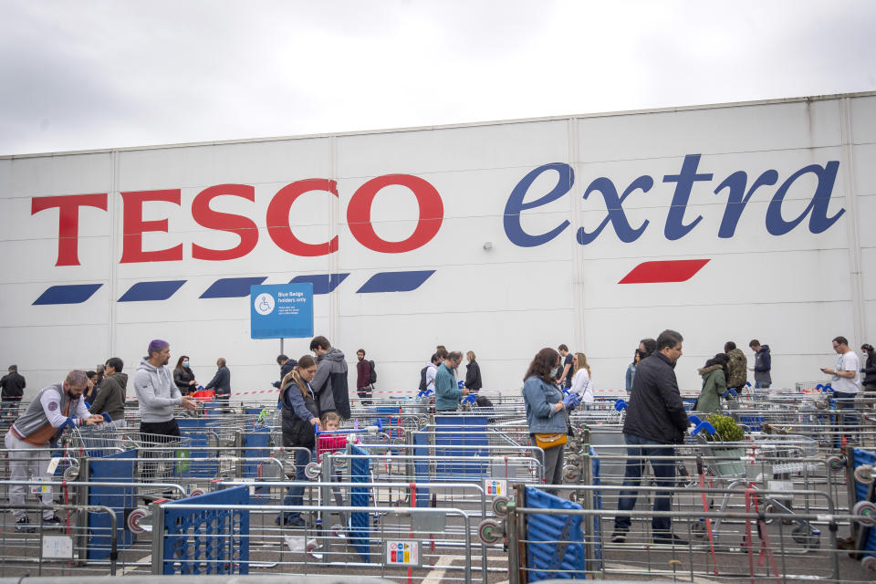 A long queue maintaining social distancing outside a Tesco supermarket in north London as the UK continues in lockdown to help curb the spread of the coronavirus. (Photo by Victoria Jones/PA Images via Getty Images)