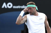 Tennys Sandgren of the U.S. reacts after winning a point against compatriot Sam Querrey during their third round singles match at the Australian Open tennis championship in Melbourne, Australia, Friday, Jan. 24, 2020. (AP Photo/Dita Alangkara)