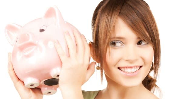 picture of lovely girl with big piggy bank