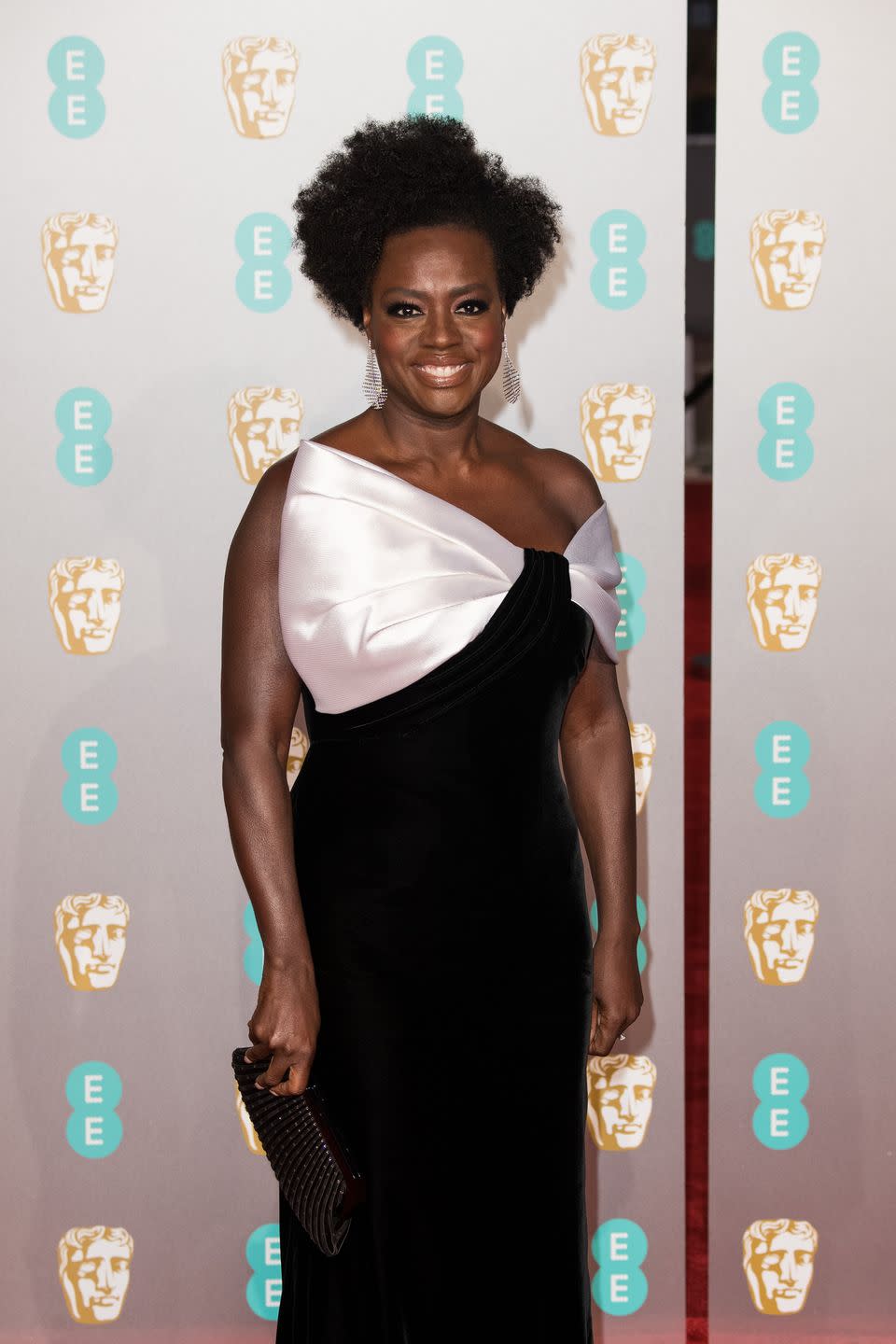 <p>If you want your curls to shine once they're short, ask for layers—and a lot of them. This gives each section its own space, so you have volume instead of short, but heavy hair. The style is seen here on Viola Davis.</p>