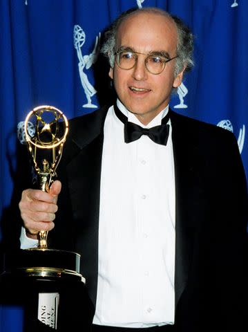 <p>Jeff Kravitz/FilmMagic</p> Larry David winning an Emmy in 1993