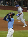 Los Angeles Dodgers first baseman Max Muncy celebrates a home run off Tampa Bay Rays starting pitcher Tyler Glasnow during the fifth inning in Game 5 of the baseball World Series Sunday, Oct. 25, 2020, in Arlington, Texas. (AP Photo/Tony Gutierrez)