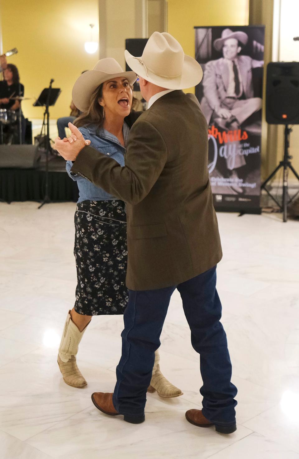 Andrea Ruby, granddaughter of Bob Wills, and Robert Huston dance in the second-floor rotunda at Bob Wills Day at the state Capitol Monday, March 6, 2023, in Oklahoma City.