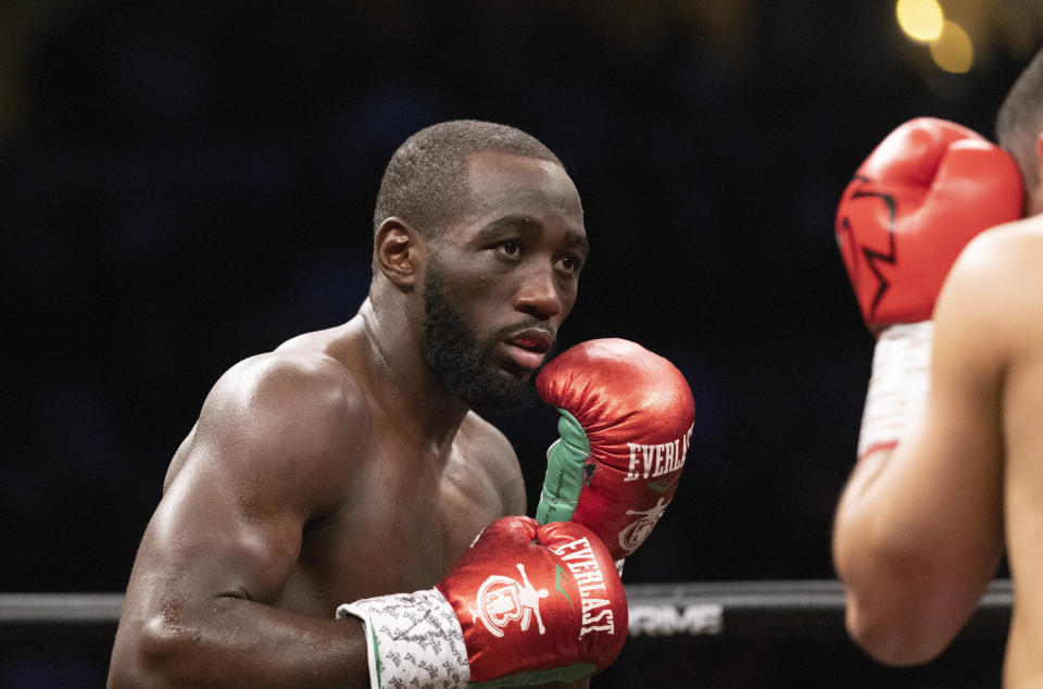 FILE - Terence "Bud" Crawford, left, fights David Avanesyan during a WBO welterweight title boxing bout on Saturday, Dec. 10, 2022, in Omaha, Neb. Crawford and Errol Spence Jr. will meet in a much anticipated showdown when they fight for the undisputed welterweight championship July 29, 2023, in Las Vegas. (AP Photo/Rebecca S. Gratz, File)