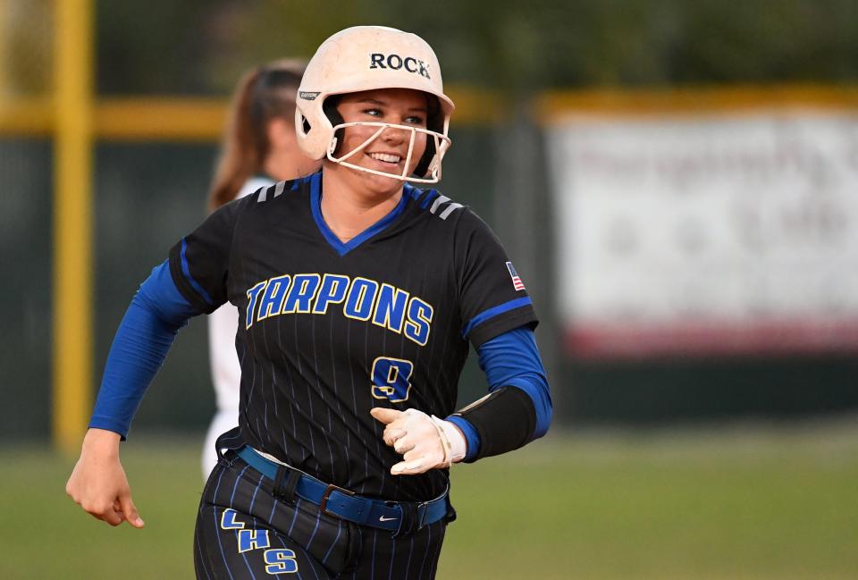 Charlotte High's Faith Wharton smiling while rounding second base after hitting a home run against Venice Tuesday night, March 28, 2023, at Venice High School.