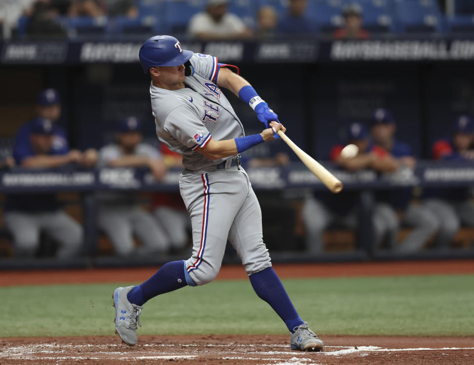 Texas Rangers' Josh Jung hits a solo home run in the second inning of a baseball game against the Tampa Bay Rays, Sunday, Sept. 18, 2022, in St. Petersburg, Fla. (AP Photo/Mark LoMoglio)