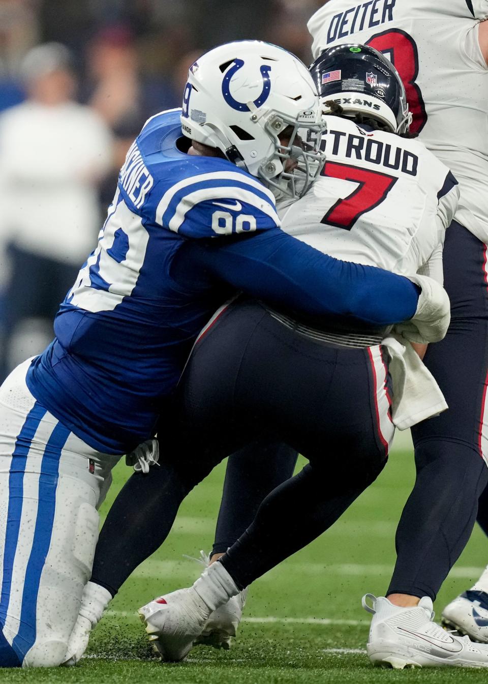 Indianapolis Colts defensive tackle DeForest Buckner (99) sacks Houston Texans quarterback C.J. Stroud (7) on Jan. 6 during a game against the Houston Texans in Indianapolis.