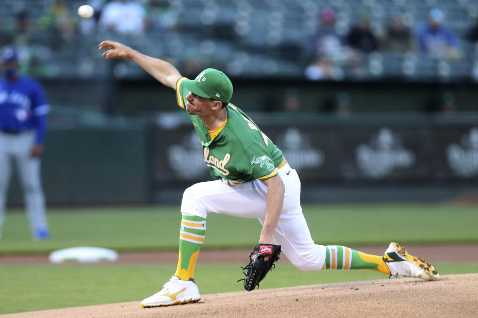 Oakland Athletics' Chris Bassitt throws to a Toronto Blue Jays batter during the first inning of a baseball game in Oakland, Calif., Wednesday, May 5, 2021. (AP Photo/Jed Jacobsohn)