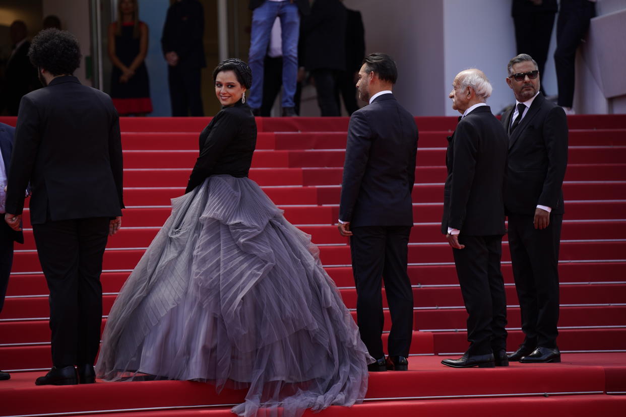 FILE - Taraneh Alidoosti, center, poses for photographers upon arrival at the premiere of the film 'Leila's Brothers' at the 75th international film festival, Cannes, southern France, Wednesday, May 25, 2022. Iranian authorities arrested Alidoosti, one of the country’s most famous actresses on charges of spreading falsehoods about nationwide protests that grip the country, state media said Saturday, Dec. 17. (AP Photo/Daniel Cole, File)