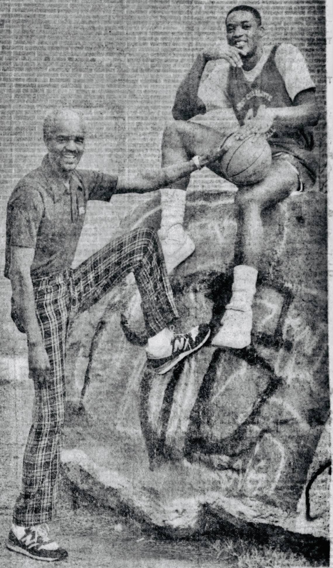 West Charlotte coach Charles McCullough and center Kevin Reid in 1986