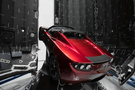 A red Tesla Roadster is seen during preparations to use it as a mock payload for the launch of a SpaceX Falcon Heavy rocket, in Cape Canaveral, Florida, U.S. December 6, 2017. Picture taken December 6, 2017. Flickr.com/photos/SpaceX via REUTERS