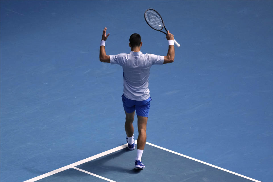 Novak Djokovic of Serbia reacts during his semifinal against Jannik Sinner of Italy at the Australian Open tennis championships at Melbourne Park, Melbourne, Australia, Friday, Jan. 26, 2024. (AP Photo/Louise Delmotte)