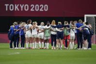 Britain players celebrate at the end of women's soccer match against Japan at the 2020 Summer Olympics, Saturday, July 24, 2021, in Sapporo, Japan. Britain won 1-0. (AP Photo/Silvia Izquierdo)