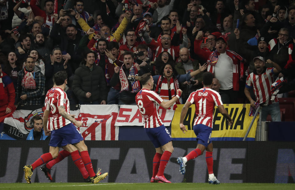 Saul Niguez (C) celebrates towards the crowd after scoring a goal for Atletico Madrid.