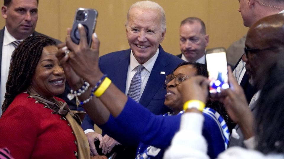 PHOTO: President Joe Biden takes pictures with attendees as he attends the Brookland Baptist Banquet Center for their 'Sunday Lunch'  in West Columbia, South Carolina, on Jan. 28, 2024.  (Kent Nishimura/AFP via Getty Images)